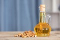 Walnut kernels and a bottle of walnut oil Royalty Free Stock Photo