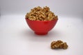 Walnut Kernels In Red Bowl Other Names: Juglans Regia, Persian Walnut, English Walnut, Circassian Walnut. Isolated Image On A Royalty Free Stock Photo