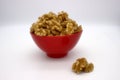 Walnut Kernels In Red Bowl Other Names: Juglans Regia, Persian Walnut, English Walnut, Circassian Walnut. Isolated Image On A Royalty Free Stock Photo