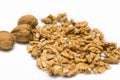 Walnut kernels and whole nutshell closeup macro, isolated on a white background