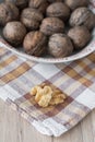 Walnut kernels and whole walnuts in background