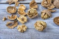 Walnut kernels and whole walnuts on the rustic grunge table