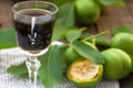 Walnut liqueur with green walnuts Royalty Free Stock Photo