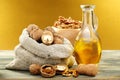 Walnut oil in bottle and nuts. Royalty Free Stock Photo