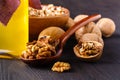 Walnut oil in bottle and nuts. Selective focus Royalty Free Stock Photo