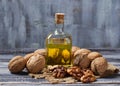 Walnut oil in bottle and nuts Royalty Free Stock Photo