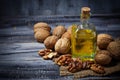 Walnut oil in bottle and nuts Royalty Free Stock Photo