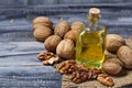 Walnut oil in bottle and nuts Royalty Free Stock Photo