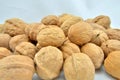Walnut pile stacked together on white background Royalty Free Stock Photo