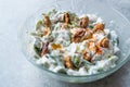 Walnut Salad with Purslane and Yogurt in Glass Bowl. Royalty Free Stock Photo