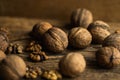 Walnut scattered on the wooden vintage table. Walnuts is a healthy vegetarian protein nutritious food. Walnut on rustic