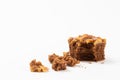Walnut toffee cake broken on white background Royalty Free Stock Photo