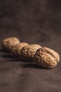 Walnut, walnuts evenly arranged on brown background