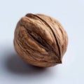A walnut on a white surface with a white background Royalty Free Stock Photo