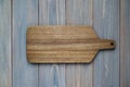 Walnut wood cutting board on a wooden gray background