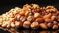 Walnuts, almonds, and hazelnuts on a reflective surface, minimalist black background. Autumn fruits Royalty Free Stock Photo