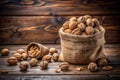 Walnuts in a bag on a rustic table, copy space Royalty Free Stock Photo