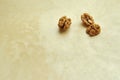 Walnuts on beige pearl background