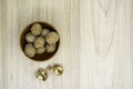 Walnuts in a bowl with a few cracked next to it on the table. Flat lay. Royalty Free Stock Photo