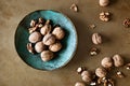 Walnuts in a bowl on a table Royalty Free Stock Photo