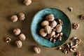 Walnuts in a bowl on a table, overhead view Royalty Free Stock Photo