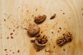 Walnuts, broken shells. Nut kernels on a wooden Board. Close up. Background or texture. Royalty Free Stock Photo