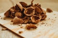 Walnuts, broken shells. Nut kernels on a wooden Board. Close up. Background or texture. Royalty Free Stock Photo