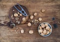 Walnuts in ceramic bowl and on cutting board with nutcracker Royalty Free Stock Photo