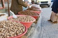 Walnuts and chestnuts are selling on the street in Turkish village in large plastic bowl. Royalty Free Stock Photo