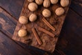 Walnuts, cinnamon and anise on wooden cutting board. Nuts and spices on the table. Food composition. Royalty Free Stock Photo