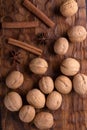 Walnuts, cinnamon and anise on wooden cutting board. Nuts and spices on the table. Food composition. Royalty Free Stock Photo