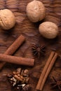 Walnuts, cinnamon and anise on wooden cutting board. Nuts and spices on the table. Food composition. Royalty Free Stock Photo