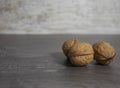 Walnuts close-up on a gray wooden background. Vitamin-rich nuts on the table. Royalty Free Stock Photo