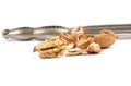 Walnuts cracked with nutcracker on white Royalty Free Stock Photo