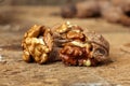 Walnuts cracked open on a wooden table