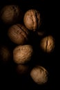 Walnuts on dark background with shadows Royalty Free Stock Photo