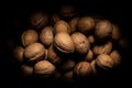 Walnuts on dark background with shadows Royalty Free Stock Photo