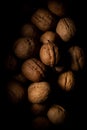 Walnuts on dark background with shadows