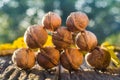 Walnuts and fallen walnut leaves on an old rustic wooden table