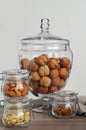 Walnuts in glass bonbonniere in the form of a wineglass, almond Royalty Free Stock Photo