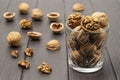 Walnuts in a glass. Walnut shells and kernel on table