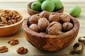 Walnuts green and dry on kitchen table background