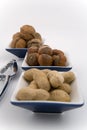 Walnuts, hazelnuts and peanuts in three bowls Royalty Free Stock Photo