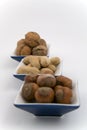 Walnuts, hazelnuts and peanuts in three bowls Royalty Free Stock Photo