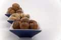 Walnuts, hazelnuts and peanuts in three bowls Royalty Free Stock Photo