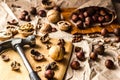 Walnuts and hazelnuts are on the table. Whole and broken nutshells lie on a brown background Royalty Free Stock Photo