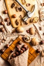 Walnuts and hazelnuts are on the table. Whole and broken nutshells lie on a brown background Royalty Free Stock Photo