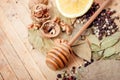 Walnuts, honey, black pepper, bay leaf on a wooden table Royalty Free Stock Photo