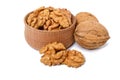 Walnuts kernels in a wooden bowl and whole nuts Royalty Free Stock Photo
