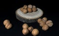 Walnut and walnuts on the black background